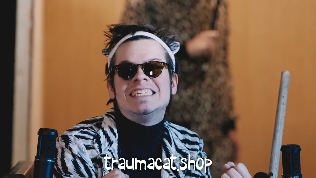 Load video: An infomercial featuring the band Trauma Cat and their official merch.